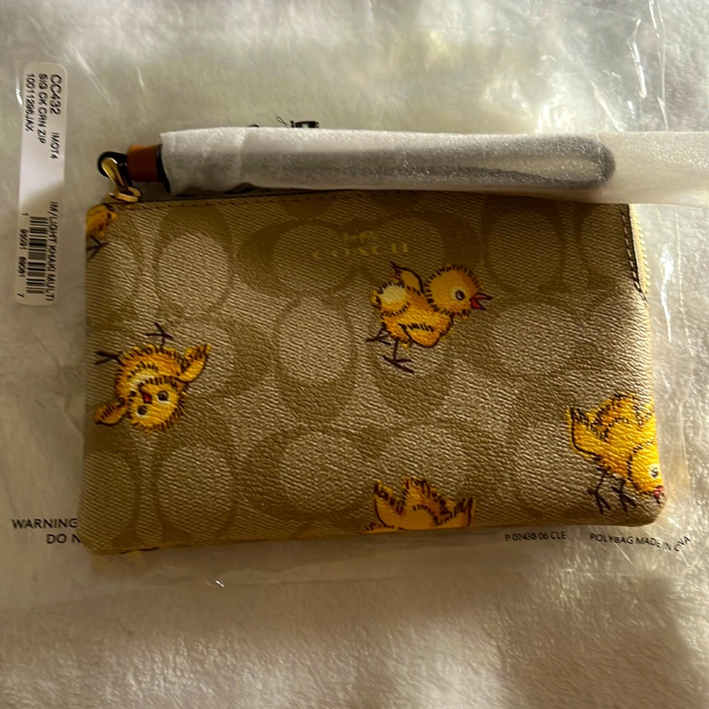 Authentic COACH Coated signature leather chicks zip top wristlet